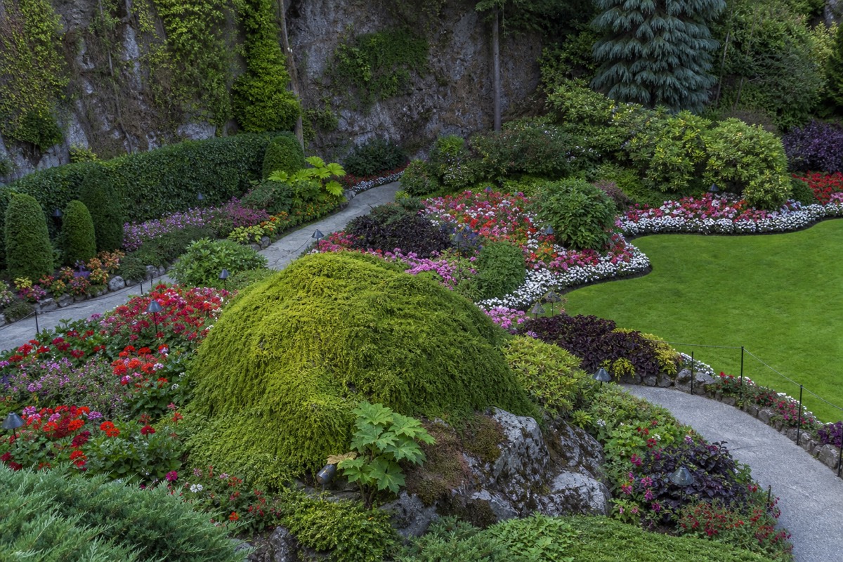 The Sunken Garden at Butchart Gardens filling a former limestone quarry with layered flower beds and a central lawn