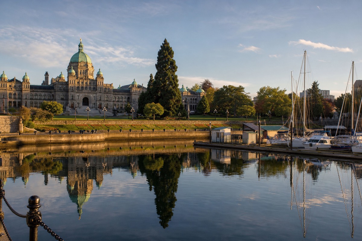 Victoria BC Inner Harbour with the Parliament Buildings, float planes and boats along the waterfront